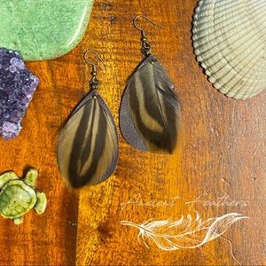 Natural feather and leather earrings.